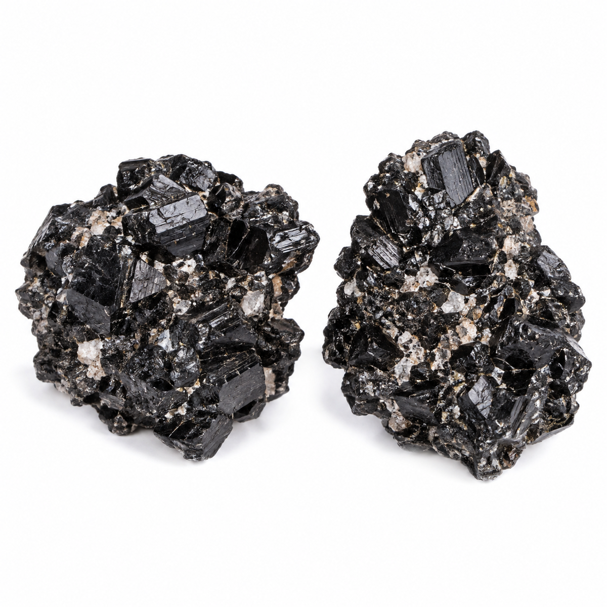 Two representative black tourmaline specimen clusters showing natural variation