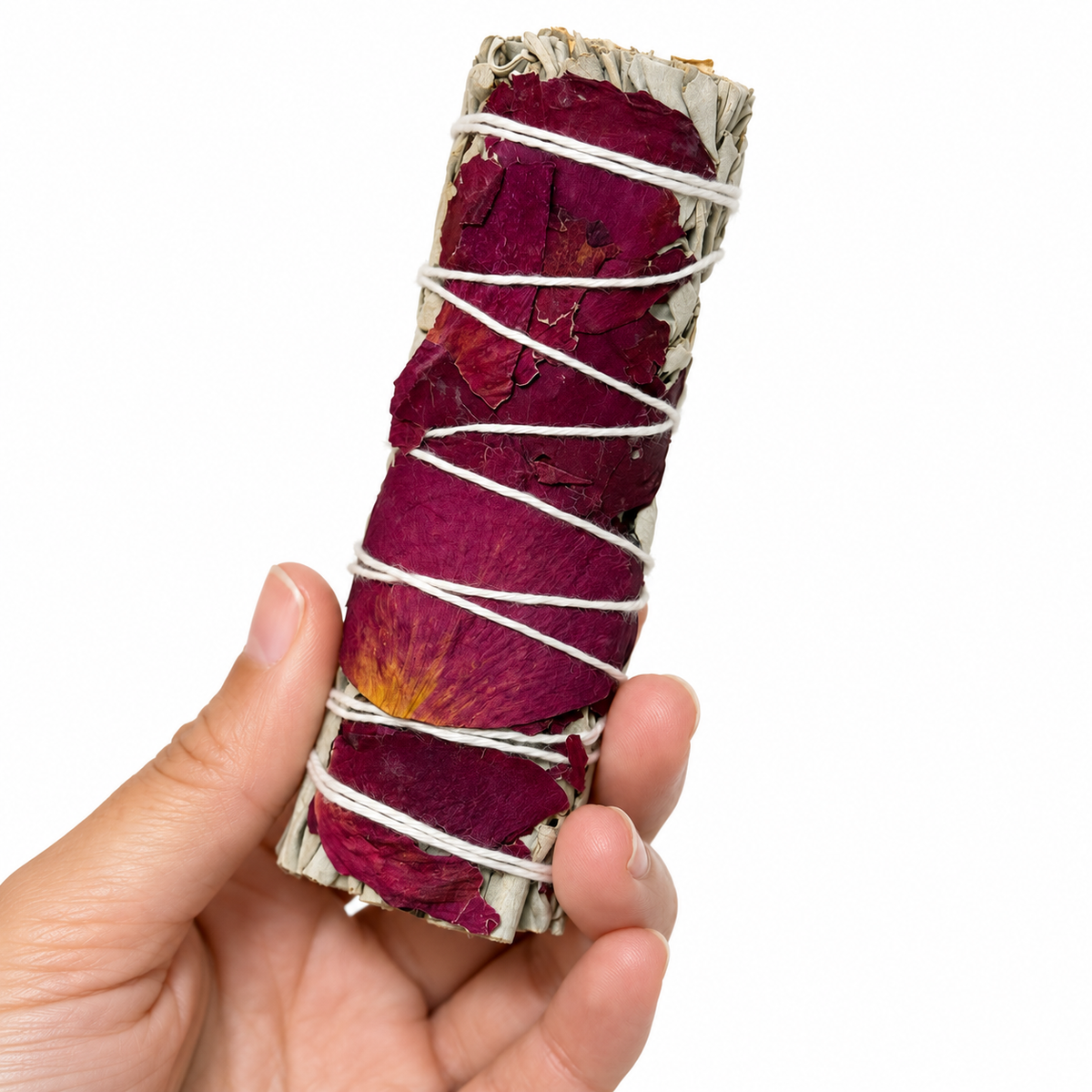 White Sage and Rose Petal Bundle held in hand on a clean white background