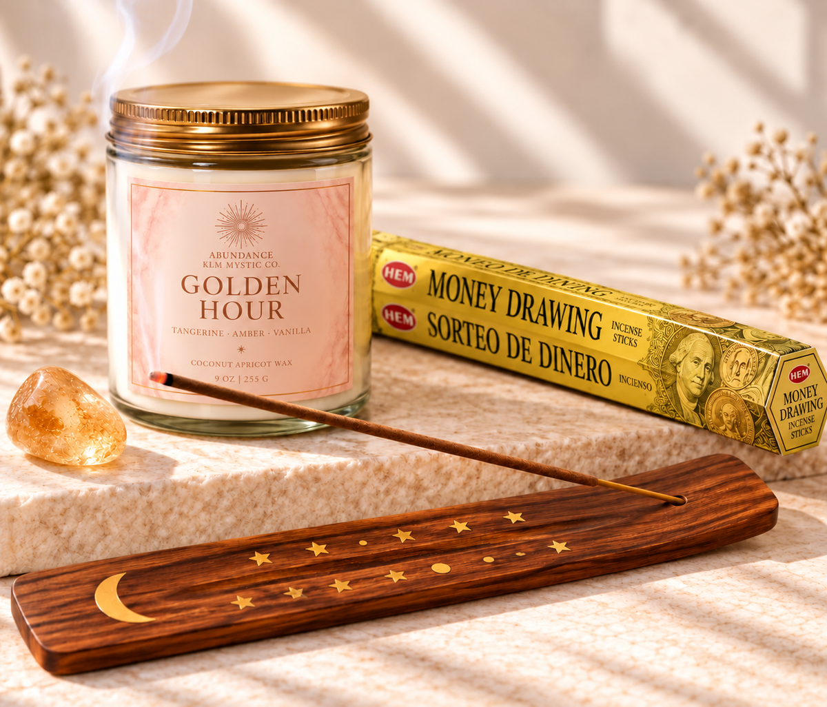 Featured items from Abundance & Success Complete Intention Set: Golden Hour candle, HEM Money Drawing incense, curved wooden holder, and one tumbled citrine stone. Additional items included; see listing.
