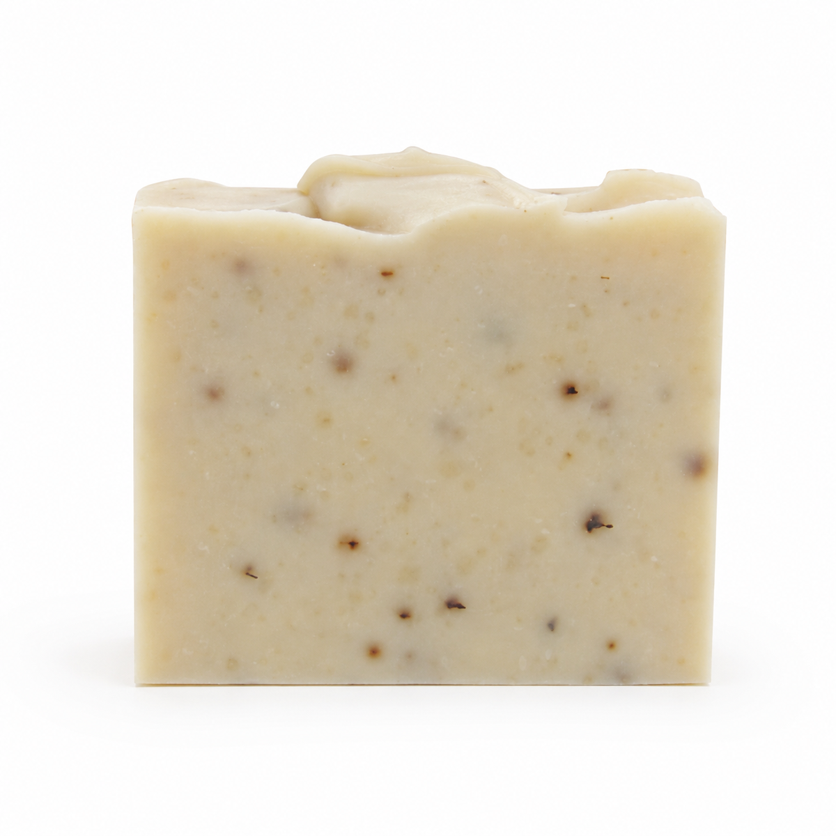 GROUND goat’s milk soap unwrapped to show the natural handmade bar