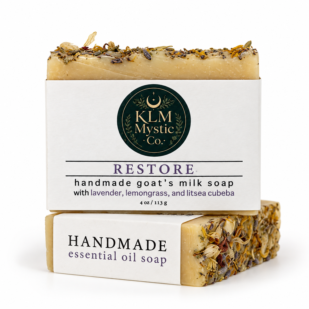 RESTORE goat’s milk soap bars stacked to show front and side label details