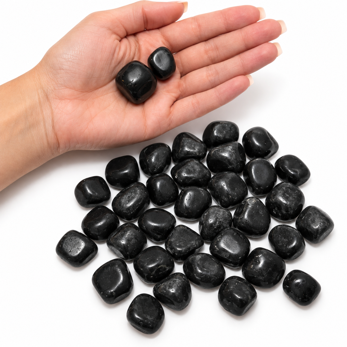 Black Tourmaline shown in hand for size reference