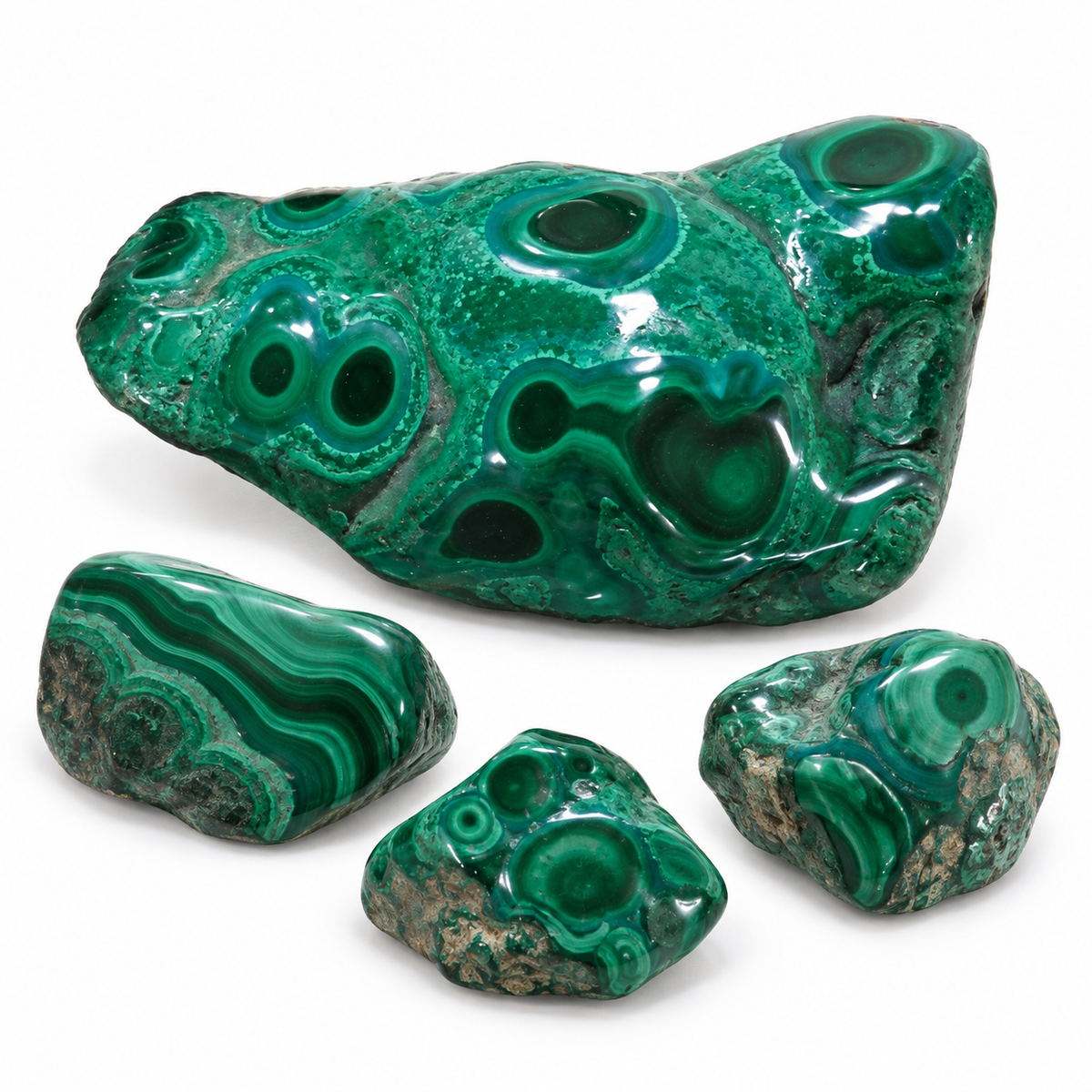 Representative malachite assortment with one medium and three smaller pieces
