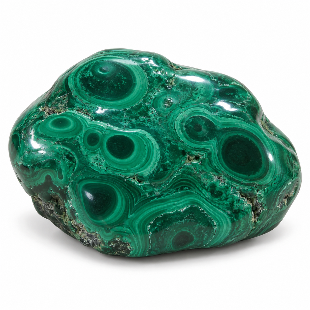 Representative rounder polished malachite free shape variation on white