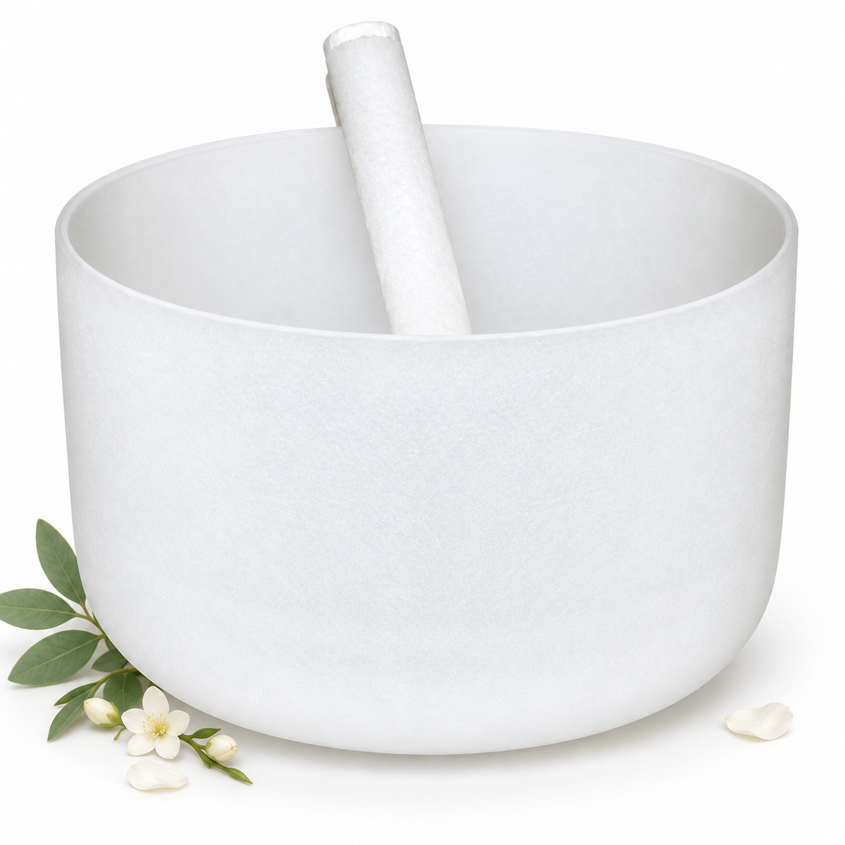 10 inch off-white crystal singing bowl with white mallet, green leaves, and delicate white flowers