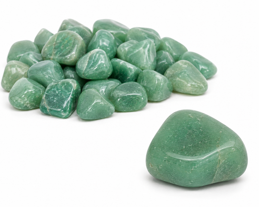 One tumbled Green Aventurine stone featured in front with a pile of Green Aventurine stones in the background